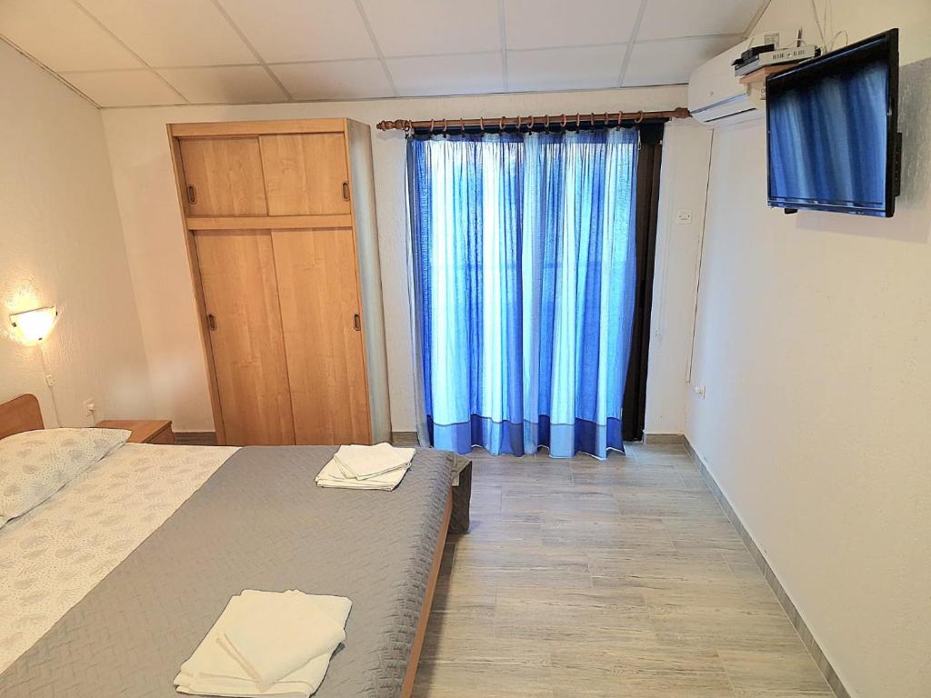 Postel nebo postele na pokoji v ubytování Apartments Ana