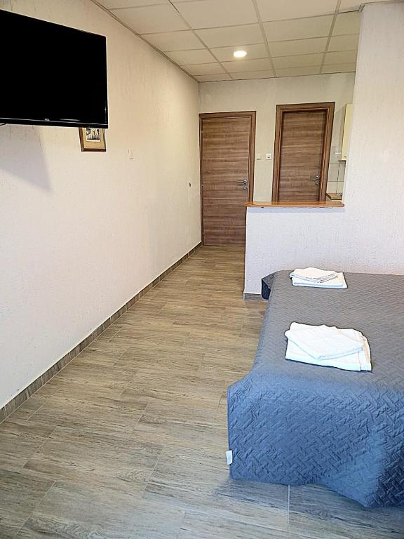 Postel nebo postele na pokoji v ubytování Apartments Ana