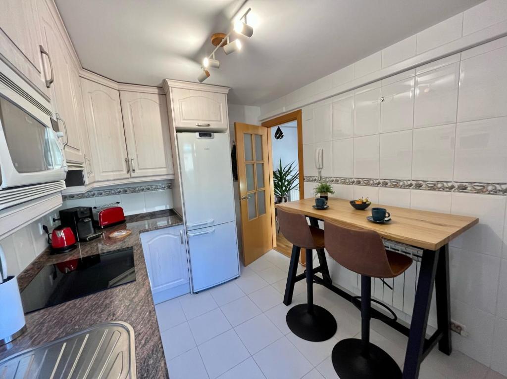 Kuchyň nebo kuchyňský kout v ubytování Tenor Apartamento inc Parking