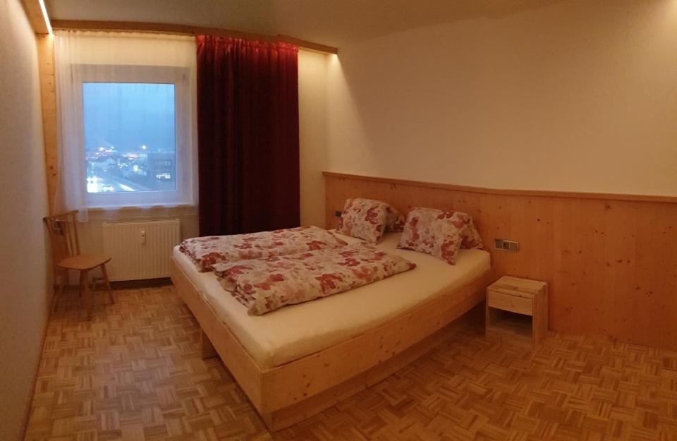 Postel nebo postele na pokoji v ubytování Alpen Appart Bludenz City