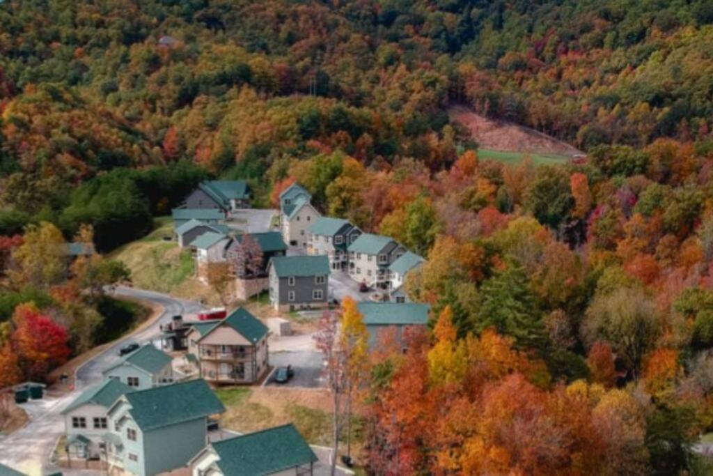 an aerial view of a small town in the autumn foliage at Shelter Me - 5 Miles to Dollywood , Hot Tub, Wi-Fi, Game Room in Pigeon Forge