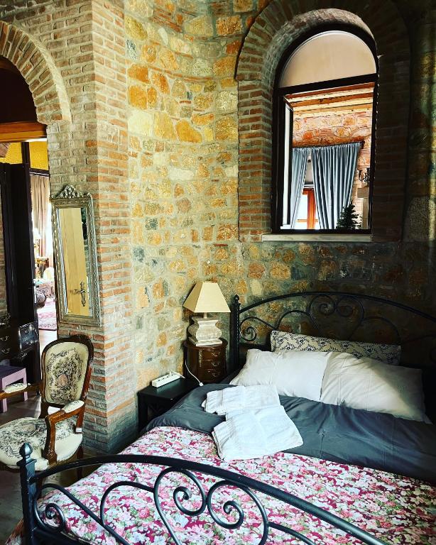 A bed or beds in a room at Lykos Mansion