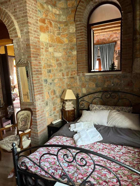 A bed or beds in a room at Lykos Mansion