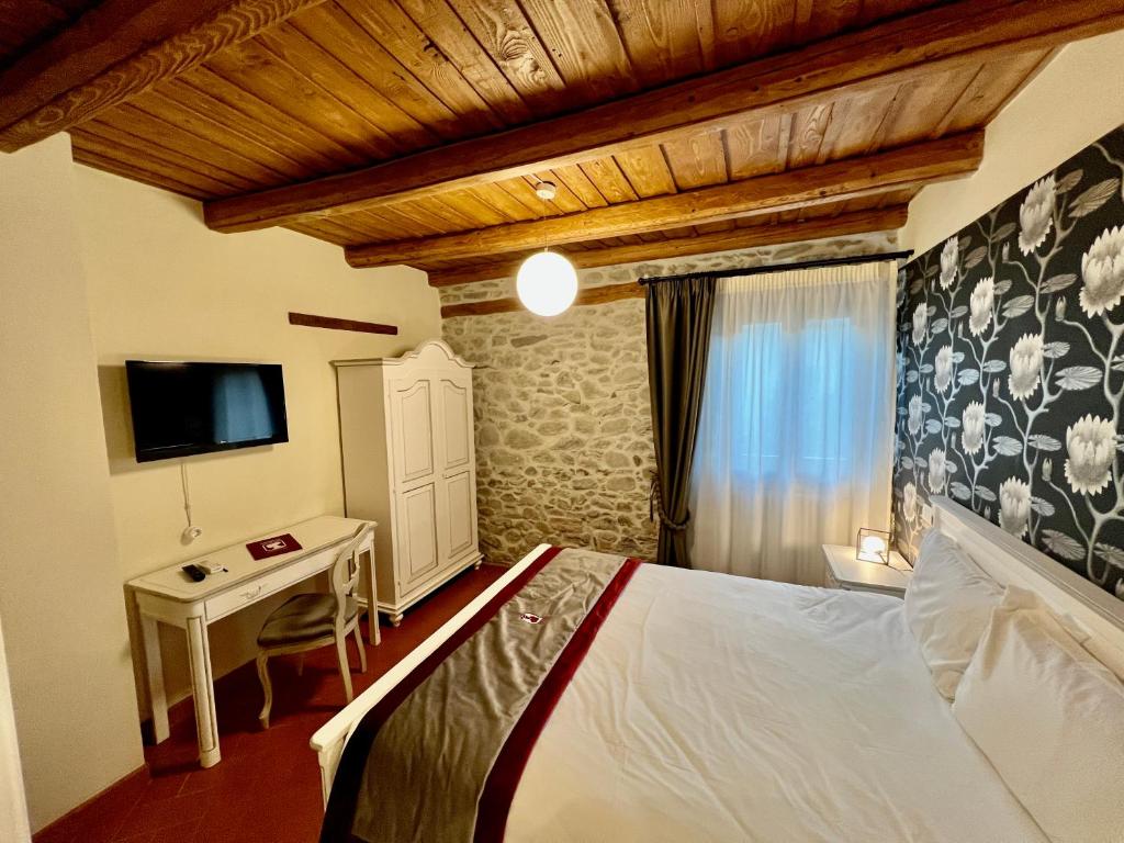Postel nebo postele na pokoji v ubytování Nobilia Dimore - Suite & Spa®