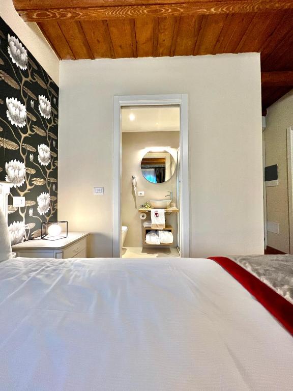 Postel nebo postele na pokoji v ubytování Nobilia Dimore - Suite & Spa®