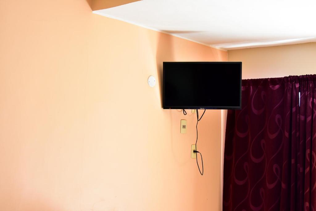 TV a/nebo společenská místnost v ubytování Palmas Park Hotel y Restaurant