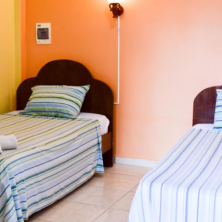 Postel nebo postele na pokoji v ubytování Palmas Park Hotel y Restaurant
