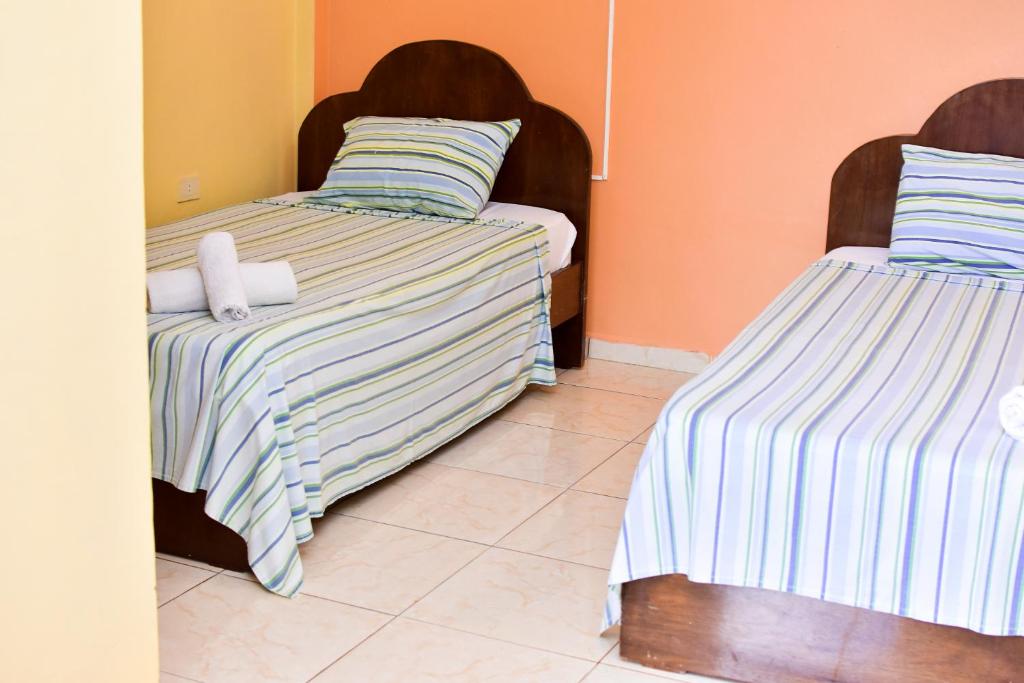 Postel nebo postele na pokoji v ubytování Palmas Park Hotel y Restaurant