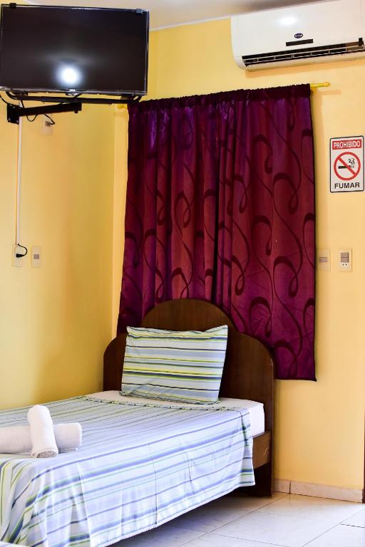 Postel nebo postele na pokoji v ubytování Palmas Park Hotel y Restaurant