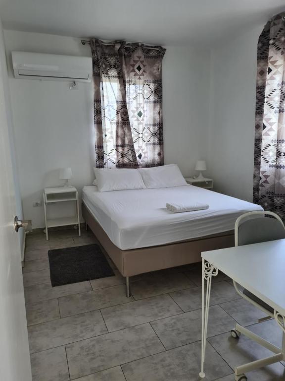 Ένα ή περισσότερα κρεβάτια σε δωμάτιο στο Downtown apartments