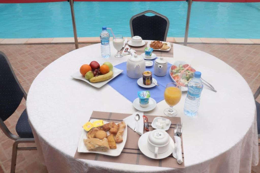 a white table with food and drinks on it at Hotel Hayatt in Nouakchott
