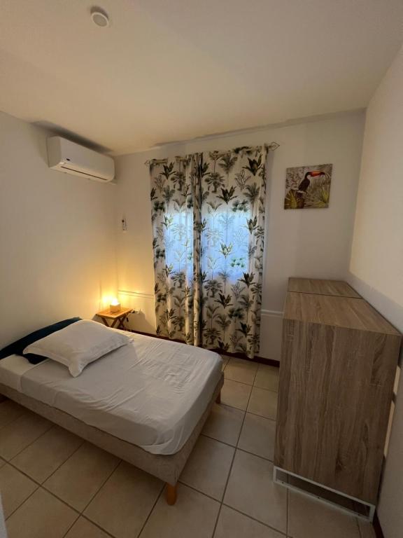 Postel nebo postele na pokoji v ubytování Villa Bambou