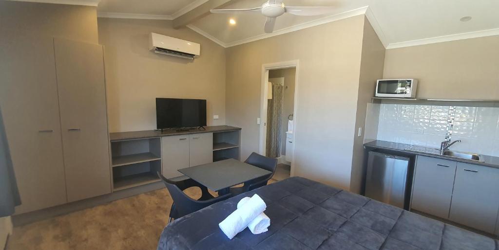 Kuchyň nebo kuchyňský kout v ubytování Sunset Caravan Park Woolgoolga