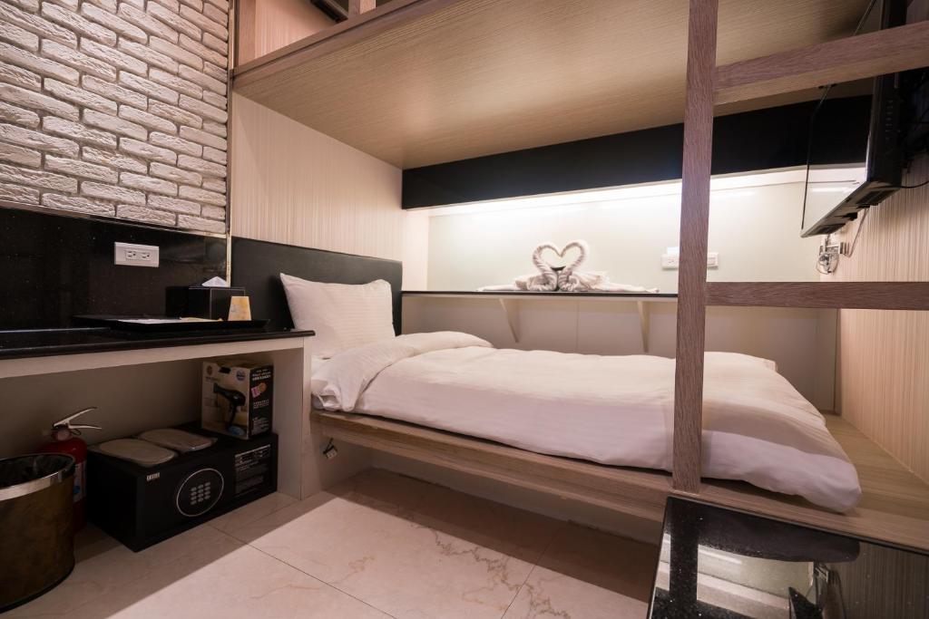 Postel nebo postele na pokoji v ubytování Kenting 157 Boutique Hotel
