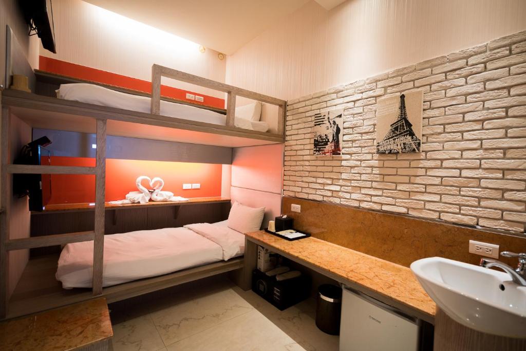 Postel nebo postele na pokoji v ubytování Kenting 157 Boutique Hotel
