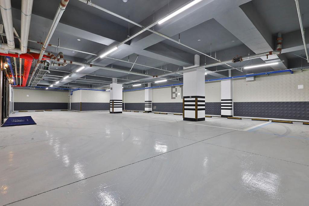 a large room with a concrete floor in a building at Daegu February Hotel Lions Park in Daegu