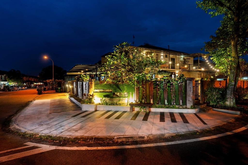 a house with a gate on a street at night at ECO Haus Garden Residential in Johor Bahru