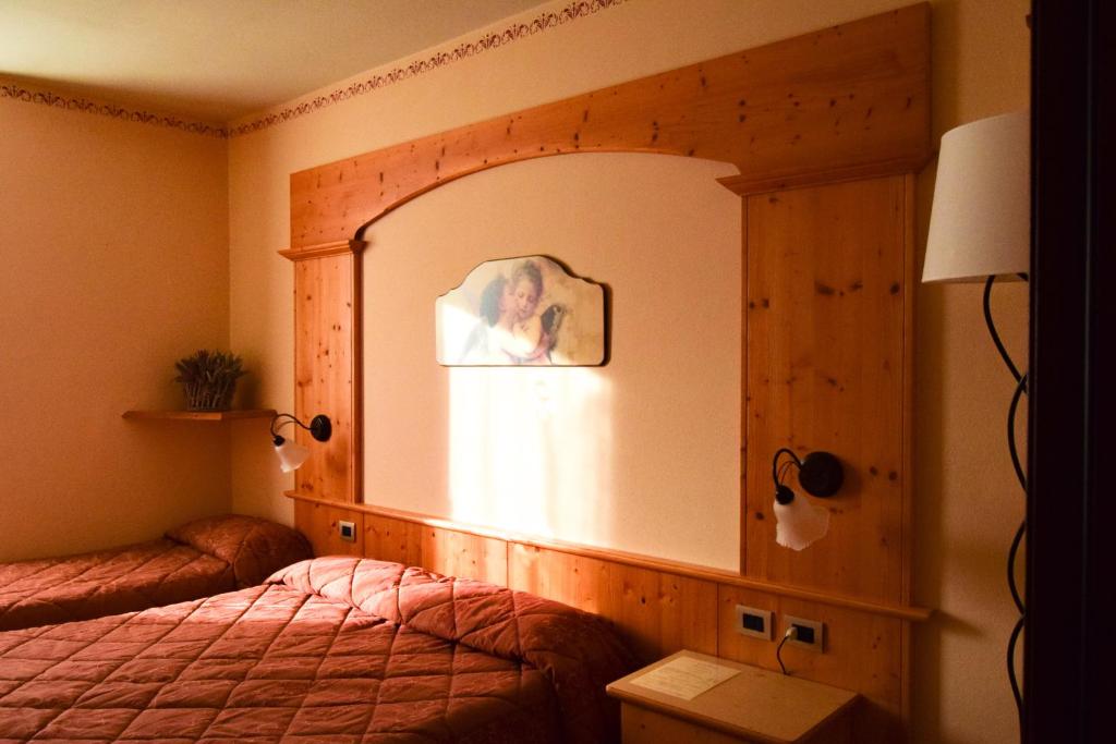 Postel nebo postele na pokoji v ubytování Hotel Moderno Restaurant