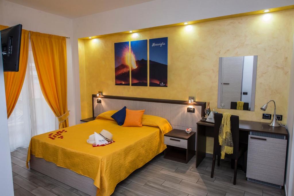 Postel nebo postele na pokoji v ubytování B&B Sunlight Tropea