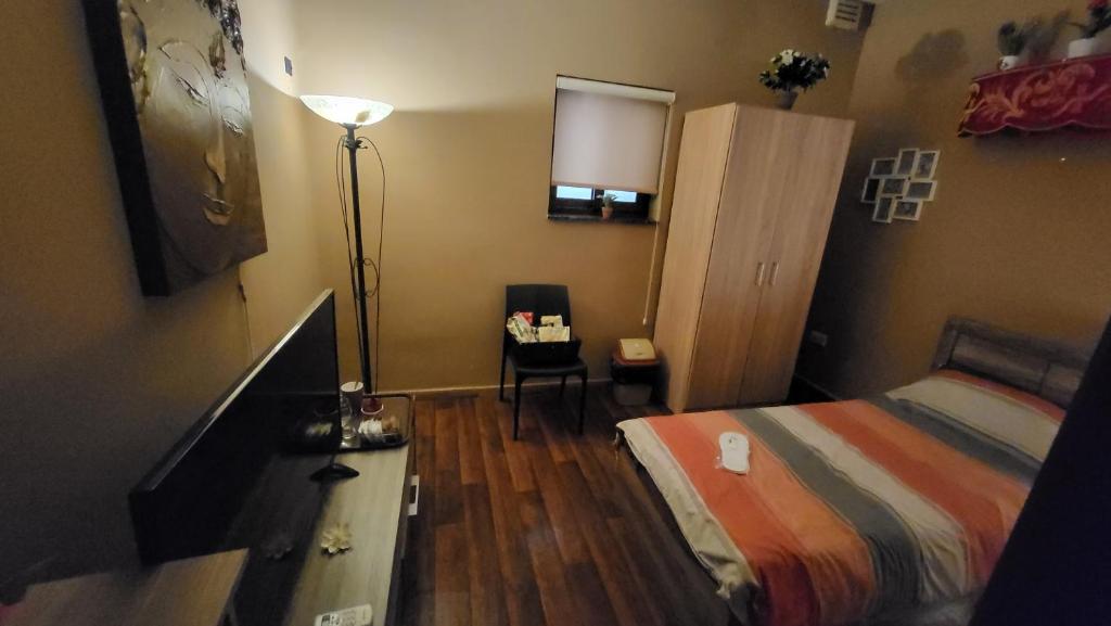 Postel nebo postele na pokoji v ubytování Lotus Guest House Malta