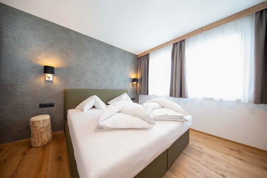 A bed or beds in a room at A CASA Granat