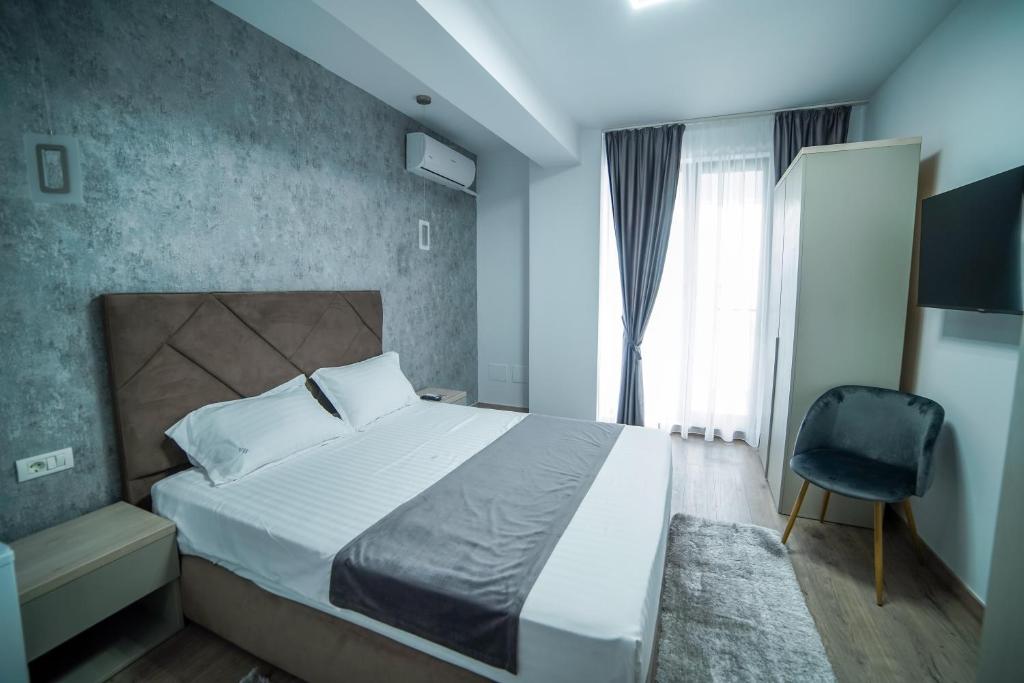 Postel nebo postele na pokoji v ubytování Hotel Ana Eforie