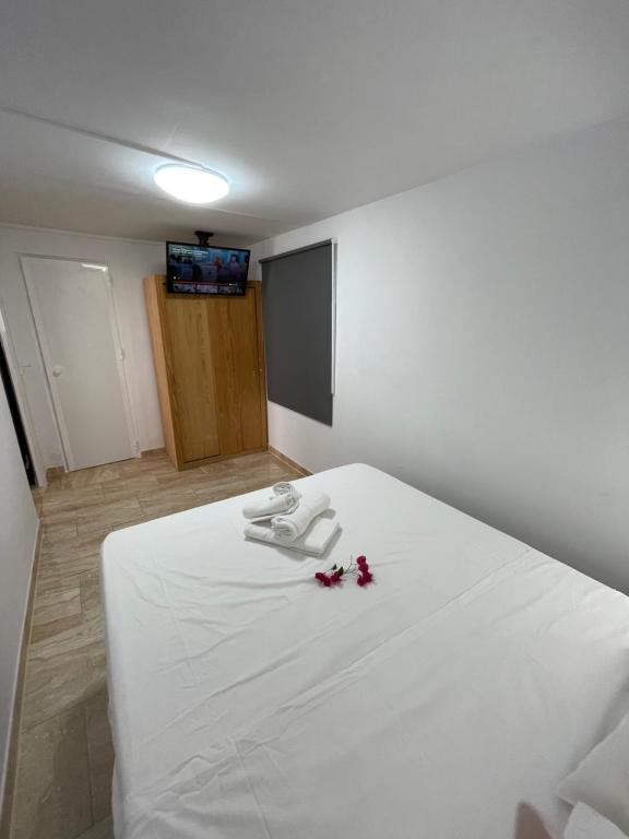 A bed or beds in a room at Apartamentos Elena