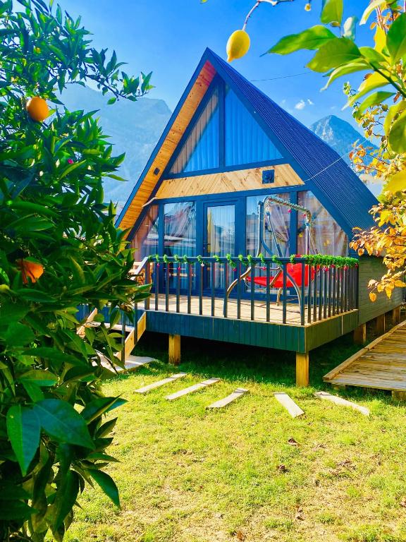 a small house with a playground in the yard at Garden Bungalows and Suites in Antalya