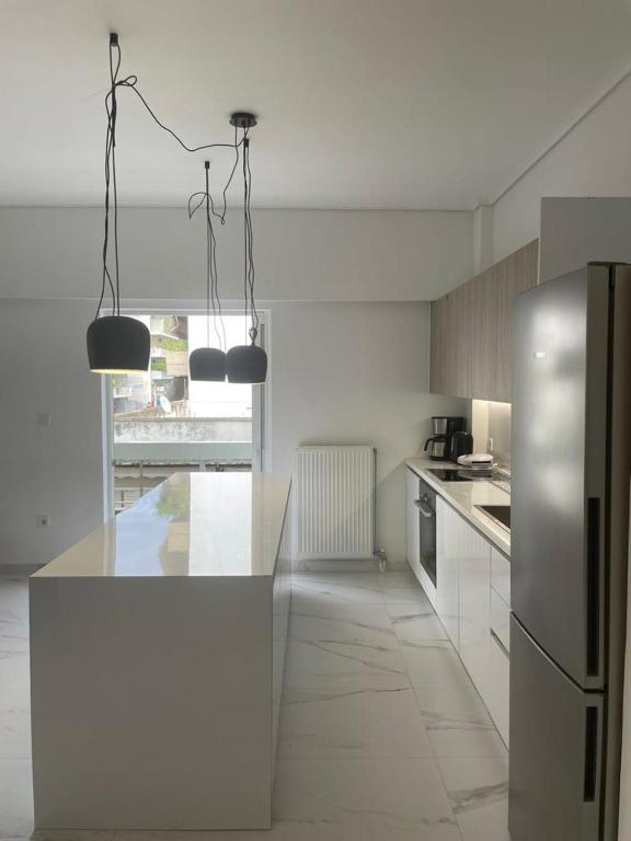 Kuchyň nebo kuchyňský kout v ubytování Downtown City Apartment