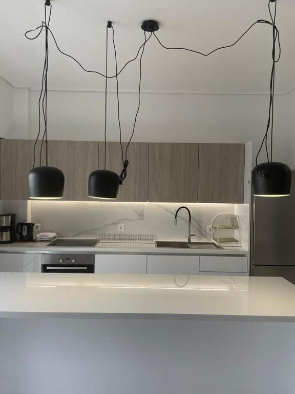 Kuchyň nebo kuchyňský kout v ubytování Downtown City Apartment