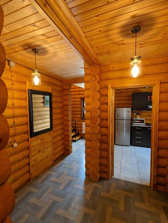 Kuchyň nebo kuchyňský kout v ubytování LOG HOUSE