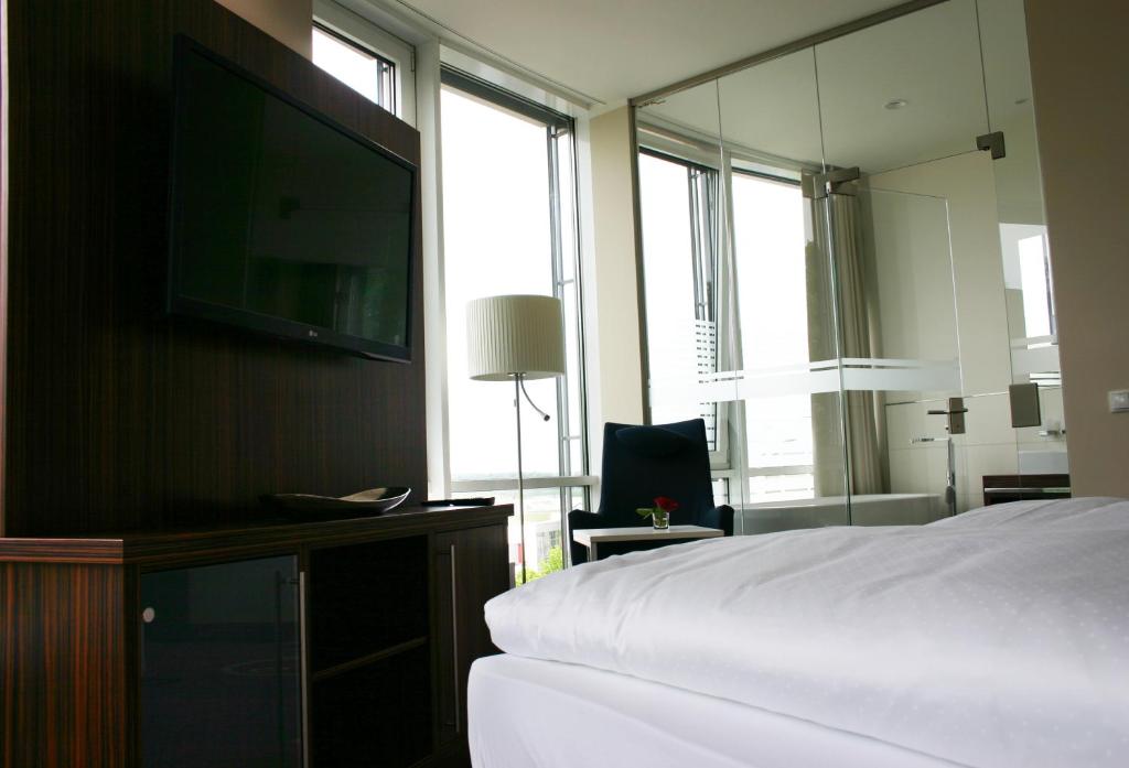 TV a/nebo společenská místnost v ubytování Business-Hotel Artes