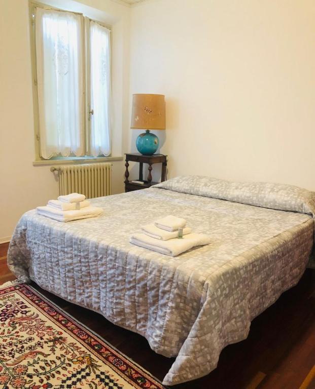 A bed or beds in a room at B&B La Chicca