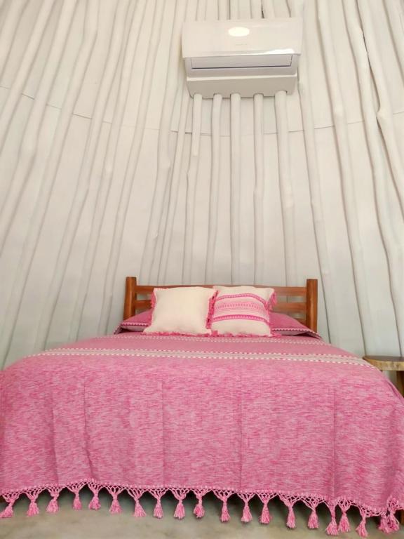 Una cama o camas en una habitación de Mimosa Tulum