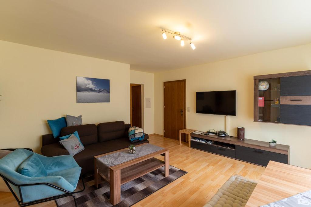TV a/nebo společenská místnost v ubytování Molto Haus