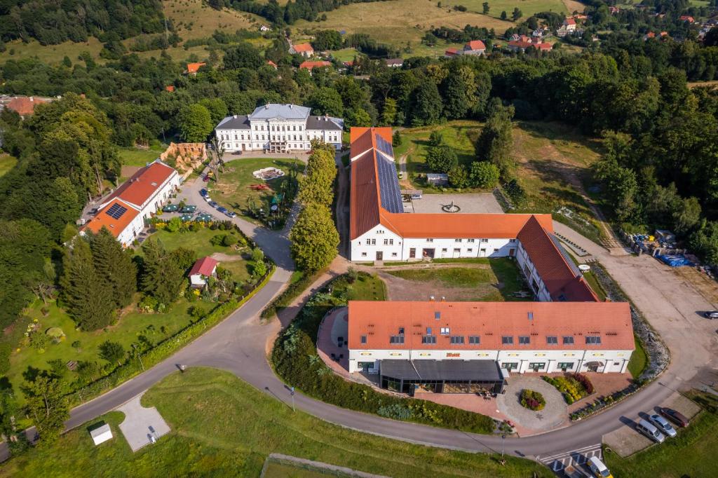 an aerial view of a large building with a road at Hotel Jedlinka in Jedlina-Zdrój