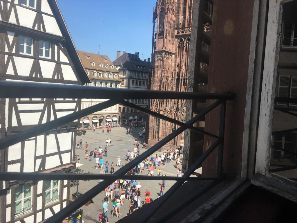 a view from a window of a crowd of people at Cathédrale spacieux appartement in Strasbourg