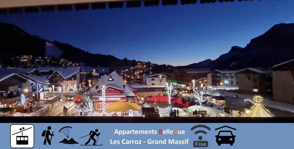 レ・キャローズ・ダラッシュにあるBelleVue centre, wifi, mountain viewの夜のクリスマスライトアップの町
