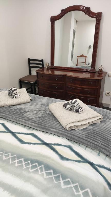 Postel nebo postele na pokoji v ubytování Apartament Melpomeny