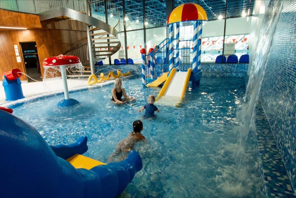 a group of children playing in a water park at Annas ielas apartamenti in Valmiera