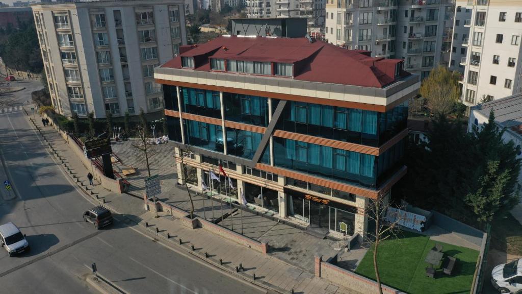 an overhead view of a building with a red roof at HMZ LUXURY HOTEL in Çekme