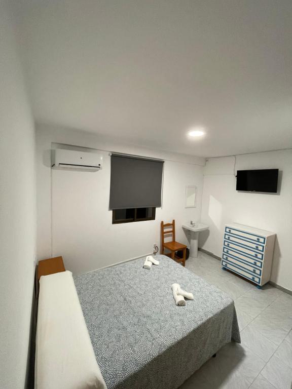Posteľ alebo postele v izbe v ubytovaní Hostal La Campiña