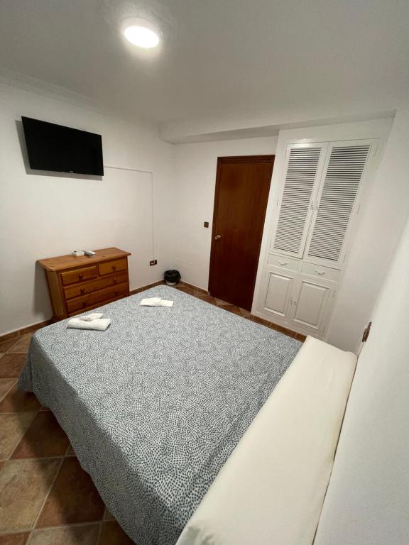 Posteľ alebo postele v izbe v ubytovaní Hostal La Campiña