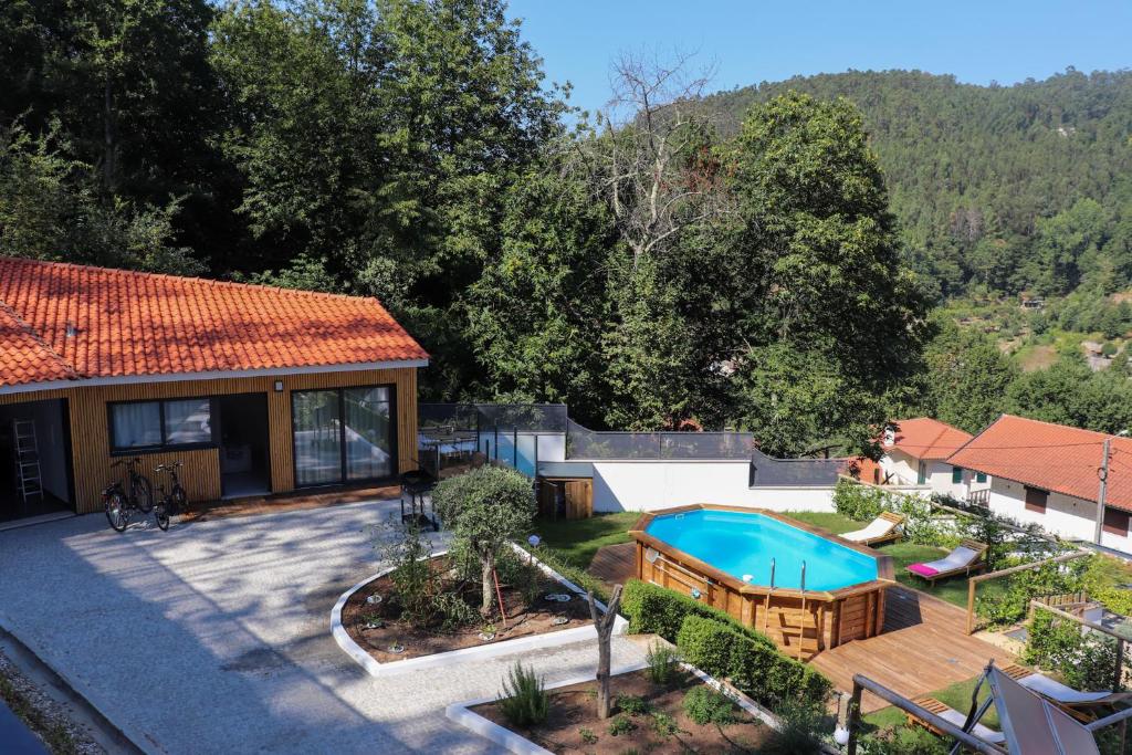 an aerial view of a house with a swimming pool at Bela Vista Urtigosa in Arouca