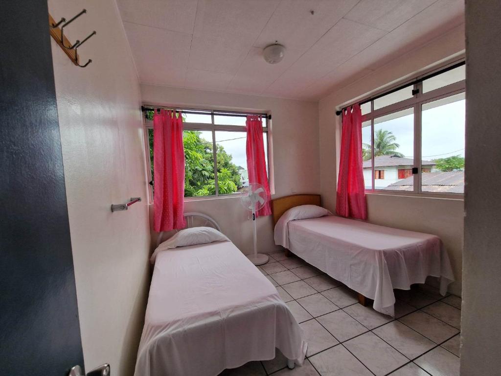 A bed or beds in a room at HIME LODGE