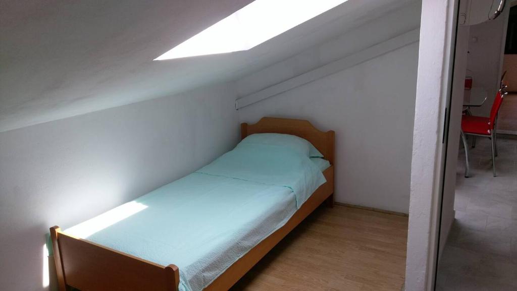 Posteľ alebo postele v izbe v ubytovaní Apartments Davorka Šimuni