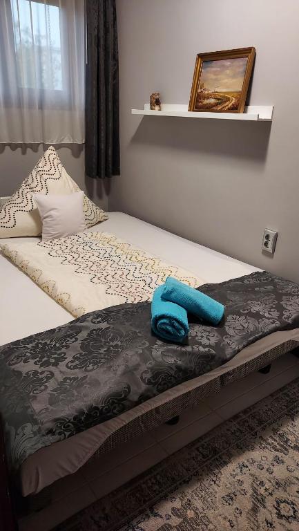 Łóżko lub łóżka w pokoju w obiekcie Titi Boutique Apartmanok