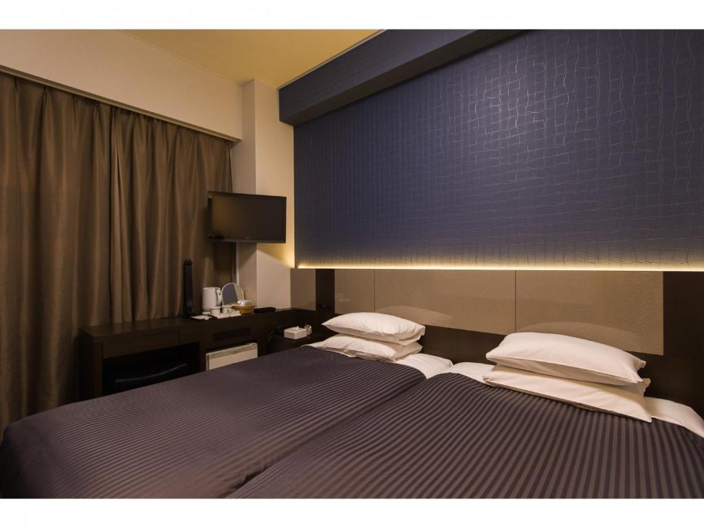 Ein Bett oder Betten in einem Zimmer der Unterkunft Ochanomizu Inn - Vacation STAY 90285v