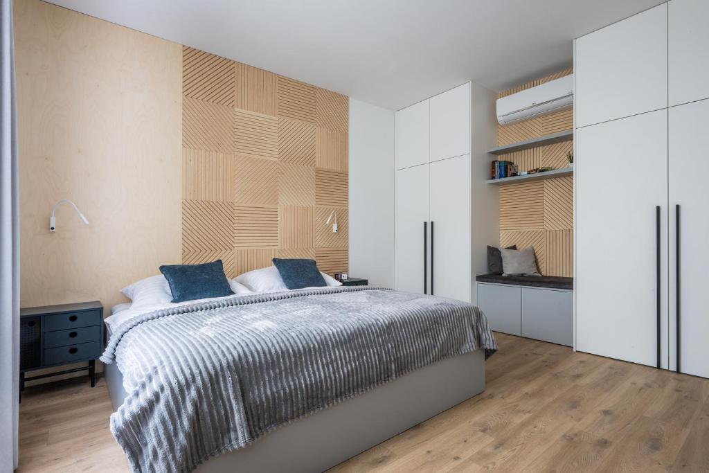 Postel nebo postele na pokoji v ubytování Apartmány u Lesa