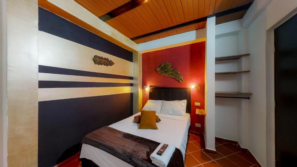 Postel nebo postele na pokoji v ubytování Casa Los Naranjos Hostal